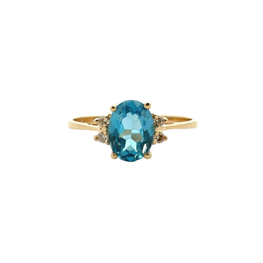 14k Yellow Gold 0.87tcw Oval Blue Topaz and 0.04cttw Diamond Ring1