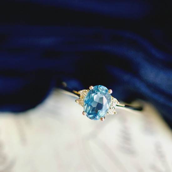 14k Yellow Gold 0.87tcw Oval Blue Topaz and 0.04cttw Diamond Ring0