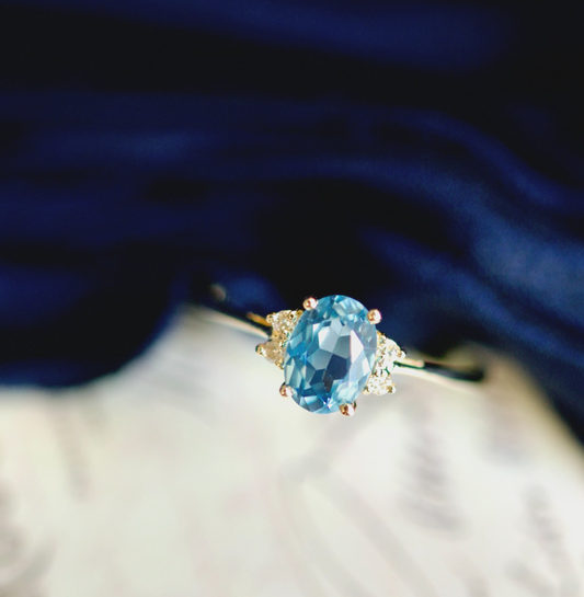 14k Yellow Gold 0.87tcw Oval Blue Topaz and 0.04cttw Diamond Ring0